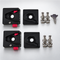 LIU HJG quick-release detachable clamp set unboxed with 2 base blocks, 2 top plates, steel bolts, nuts, and security lock key.